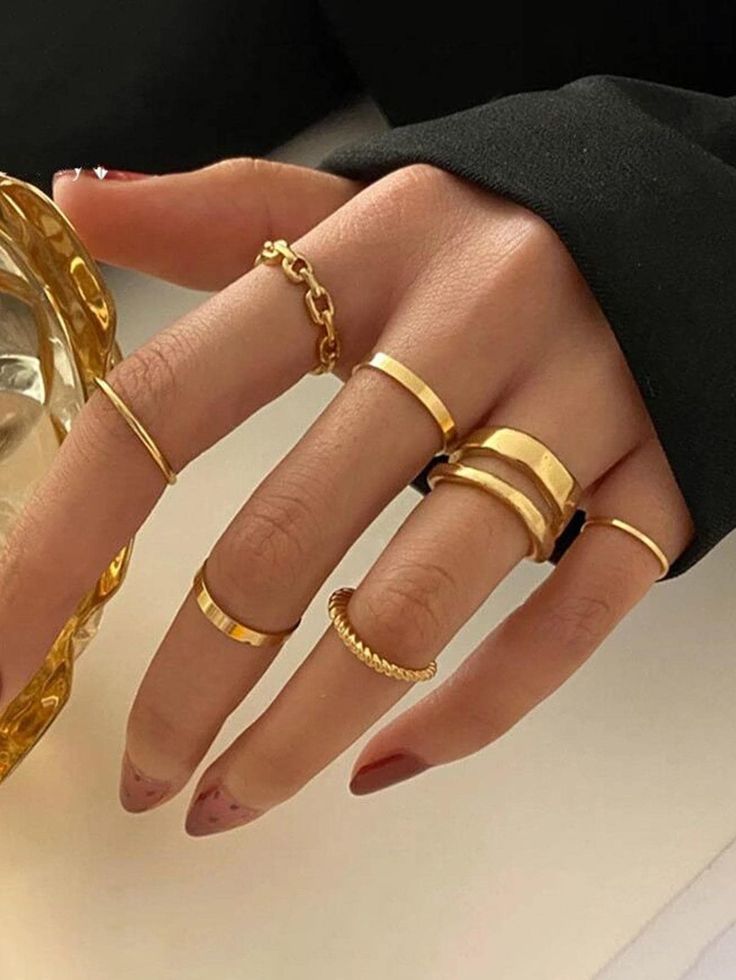Gold rings worn on fingers